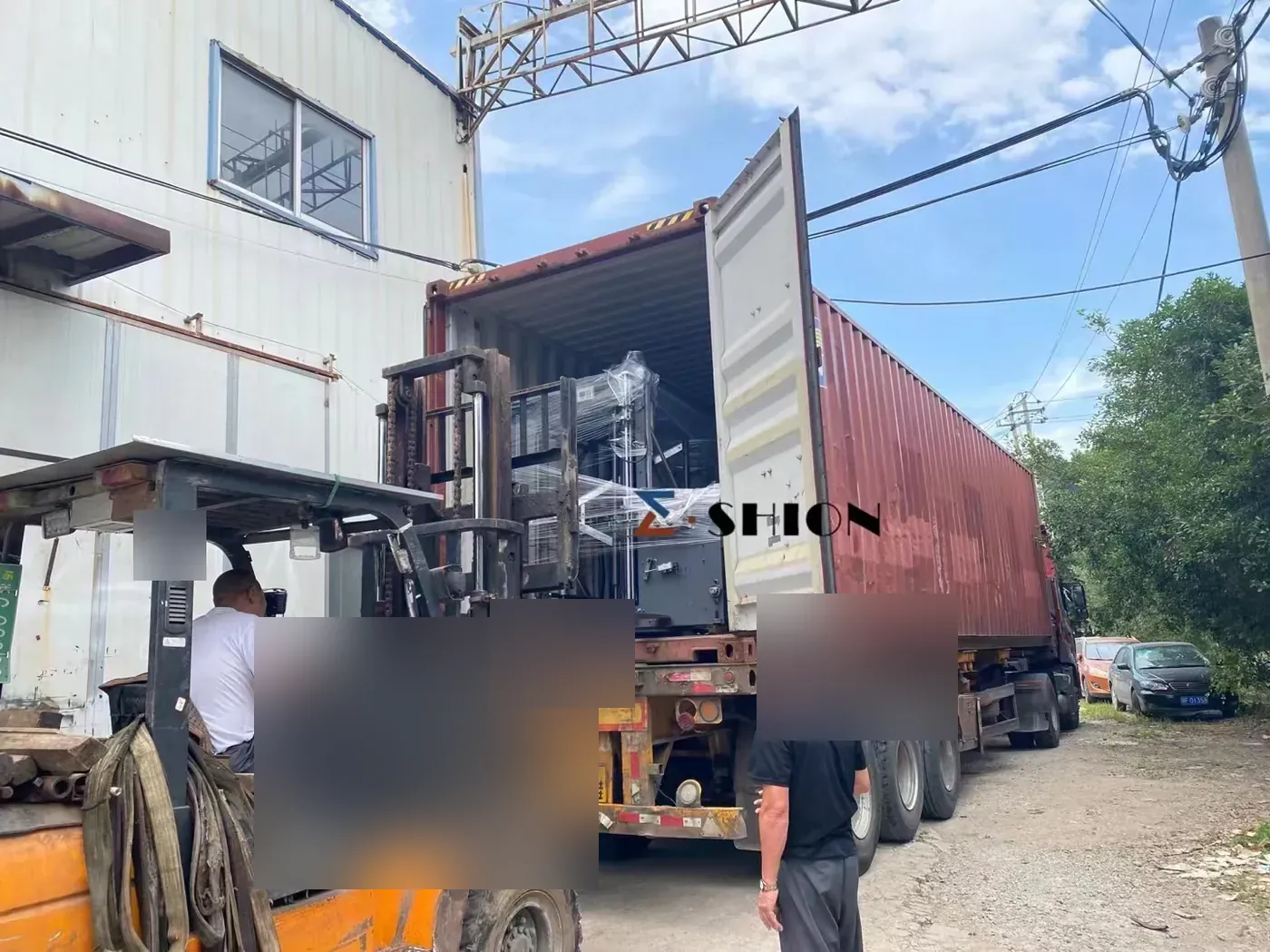 Wrapped E-SHION machinery entering a container Wrapped E-SHION machinery entering a container | E-SHION Machinery