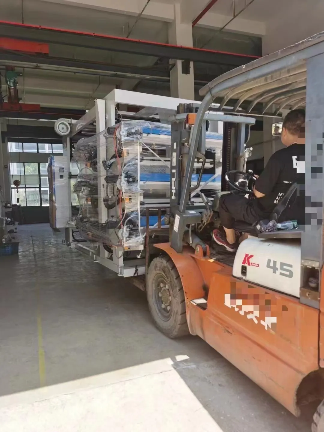 E-SHION machinery moved by forklift in the warehouse E-SHION machinery moved by forklift in the warehouse | E-SHION Machinery